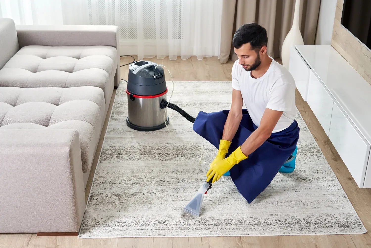 A carpet being deep cleaned using hot water extraction in a commercial building’s entrance to refresh high-traffic areas.