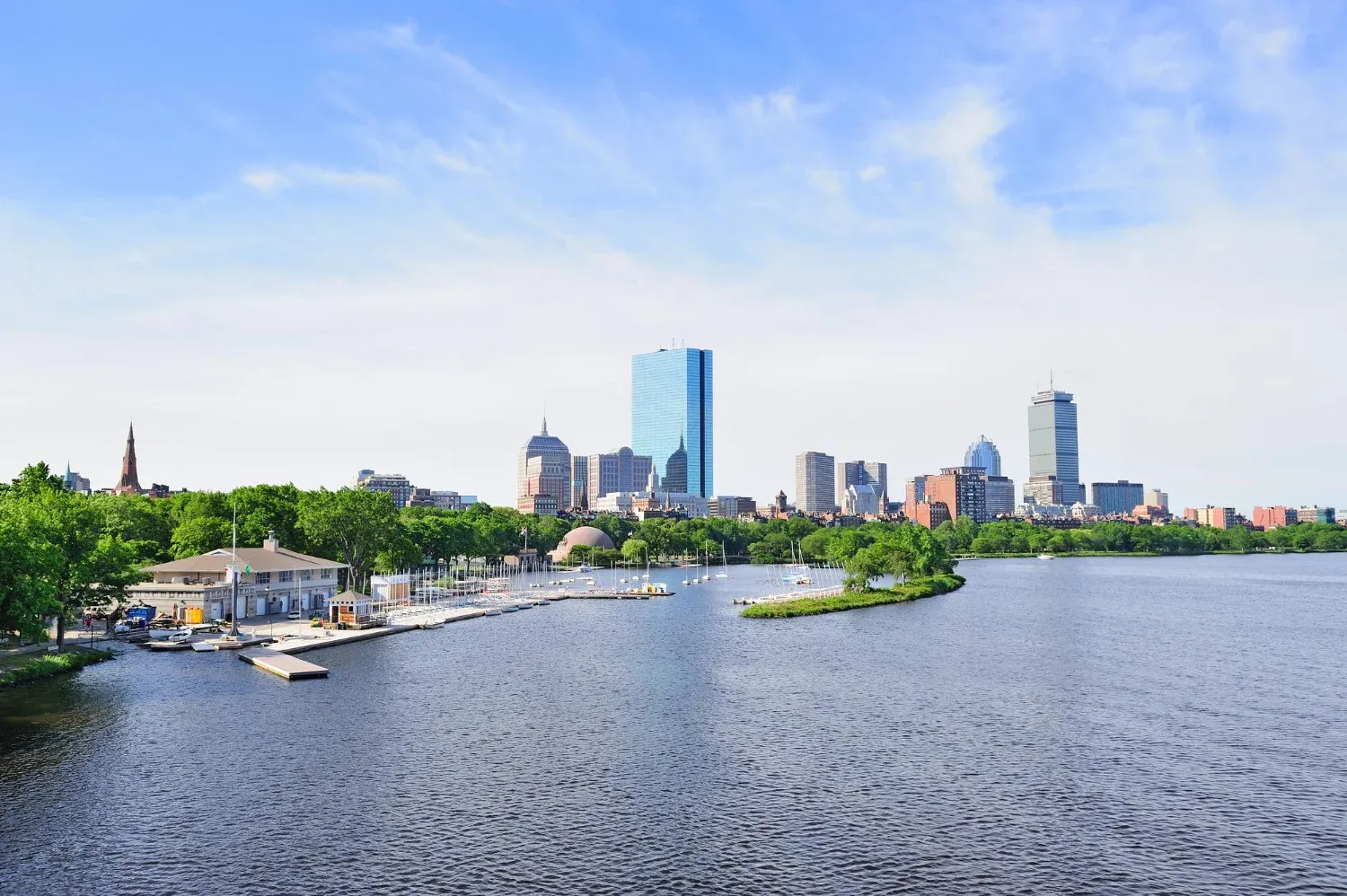 Boston back bay with sailing boat and urban building city skyline in the morning